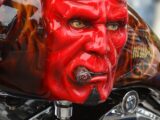 red and black motorcycle with face paint