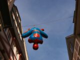 a blue balloon from a building