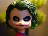 a close up of a toy with a green hair