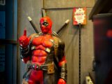 a statue of a man dressed as a deadpool