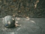 white and blue soccer ball on gray concrete floor