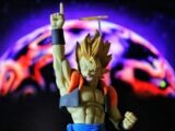A figurine of a man holding a baseball bat