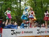 a group of people that are standing on a stage