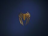 a golden spider logo on a dark blue background