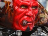 red and black motorcycle with face paint