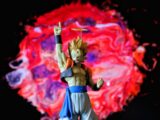 Action figure with colorful explosion background