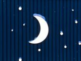 Crescent moon with snow against a dark blue background