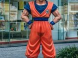 a statue of a man in a blue and orange outfit