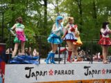 a group of people that are standing on a stage