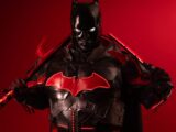 Dramatic Batman inspired cosplay featuring black and red armor against a vibrant red background.