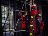 a man dressed in a deadpool costume