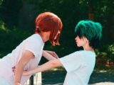 a couple of people with green hair standing next to each other
