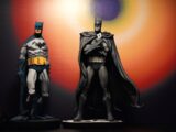 Two batman action figures are displayed together.