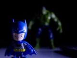 Batman toy in foreground, hulk toy in background