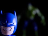 Batman toy in foreground, hulk figure in background