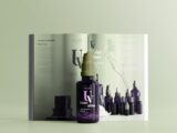 a book opened to a page with a bottle of liquid in front of it