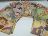 a bunch of magazines sitting on top of a table