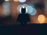 silhouette of person standing on the road during night time