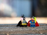 lego mini figure on brown sand