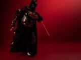 Detailed Batman cosplay in red-black theme, captured with dramatic lighting and mood.
