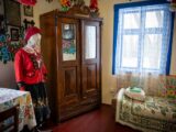 a room with a bed and a cabinet