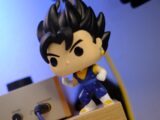 Vegito funko pop figure standing on wooden block.