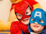 kids in spiderman and Captain America costumes