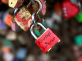 Red padlock with "always forever" written on it.